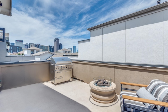 731 Spanish Oaks Pl, Dallas, TX 75204 - view of patio with a view of skyline and grilling area