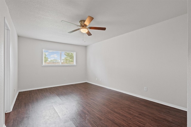 3154 Abbey Rd, Carrollton, TX 75007 - empty room with dark wood finished floors, a ceiling fan, and baseboards
