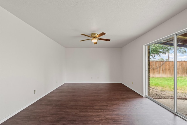 3154 Abbey Rd, Carrollton, TX 75007 - unfurnished room featuring a ceiling fan, dark wood-style flooring, and baseboards