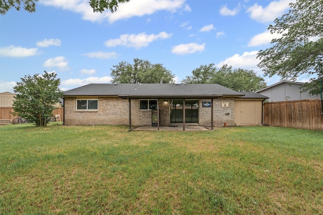 3154 Abbey Rd, Carrollton, TX 75007 - rear view of house with a patio area and brick siding