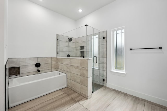 6002 Verde Way, Dallas, TX 75211 - full bath with a garden tub, a stall shower, recessed lighting, and baseboards