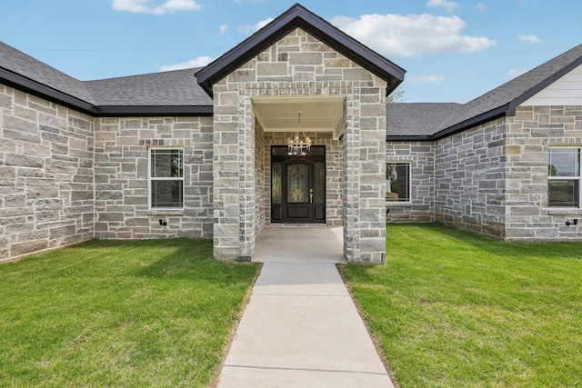 6002 Verde Way, Dallas, TX 75211 - property entrance with roof with shingles, a yard, and stone siding