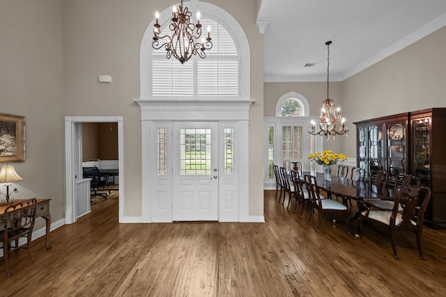 704 Longford Dr, Southlake, TX 76092 - entrance foyer featuring a chandelier, a towering ceiling, wood finished floors, ornamental molding, and baseboards