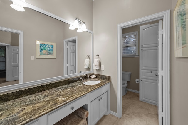 704 Longford Dr, Southlake, TX 76092 - bathroom featuring vanity, toilet, tile patterned floors, and baseboards