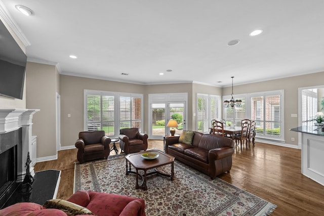 704 Longford Dr, Southlake, TX 76092 - living area with wood finished floors, a chandelier, a fireplace, recessed lighting, and baseboards