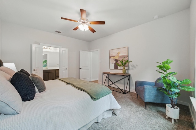 2101 Chebi Ln, Denton, TX 76209 - bedroom featuring light carpet, ensuite bathroom, and a ceiling fan