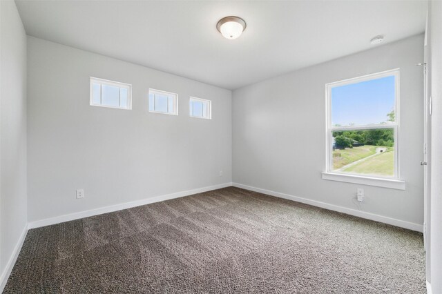 2101 Chebi Ln, Denton, TX 76209 - spare room featuring carpet flooring and a smoke detector
