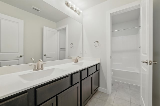 2101 Chebi Ln, Denton, TX 76209 - full bath with double vanity, tile patterned flooring, and bathing tub / shower combination