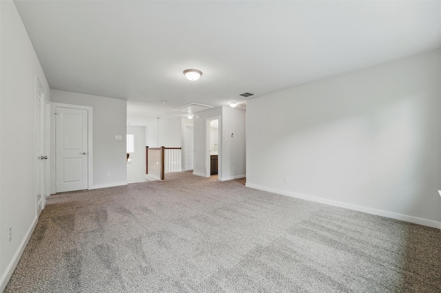 2101 Chebi Ln, Denton, TX 76209 - spare room with attic access and light colored carpet