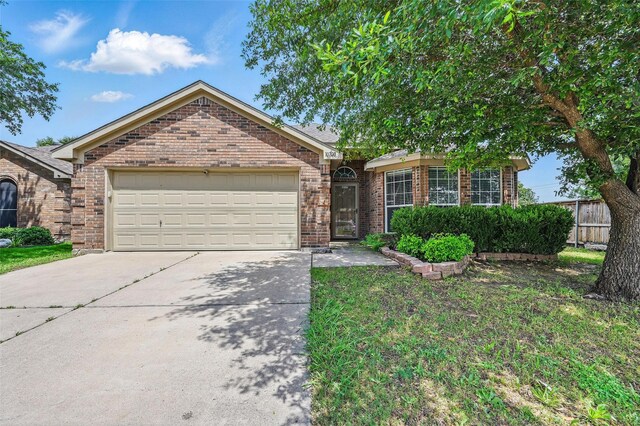 10700 Irish Glen Trl, Haslet, TX 76052 - view of front of home with brick siding, driveway, and an attached garage