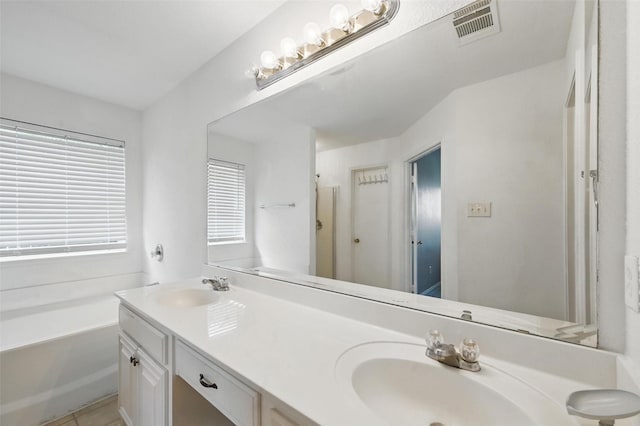 10700 Irish Glen Trl, Haslet, TX 76052 - full bath with double vanity, a bath, and tile patterned floors