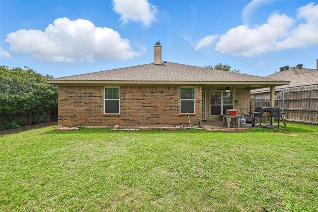 10700 Irish Glen Trl, Haslet, TX 76052 - back of house featuring a ceiling fan, a patio, a chimney, and brick siding