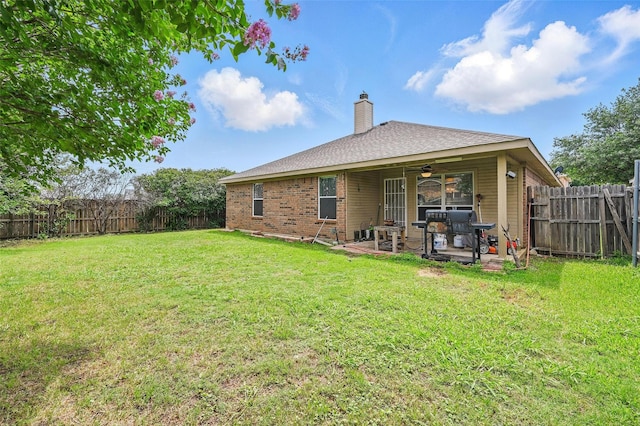 10700 Irish Glen Trl, Haslet, TX 76052 - back of property with a ceiling fan, a patio, a chimney, brick siding, and a shingled roof