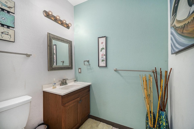5716 Wall Ave, Haltom City, TX 76117 - half bathroom with vanity and toilet