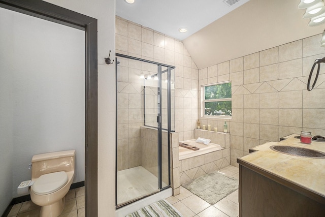 5716 Wall Ave, Haltom City, TX 76117 - full bath featuring tile patterned floors, a shower stall, lofted ceiling, vanity, and toilet