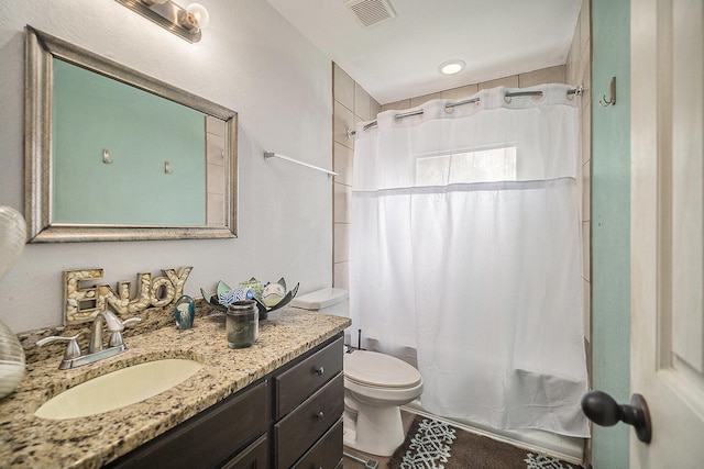 5716 Wall Ave, Haltom City, TX 76117 - bathroom featuring vanity, shower / bathtub combination with curtain, and toilet