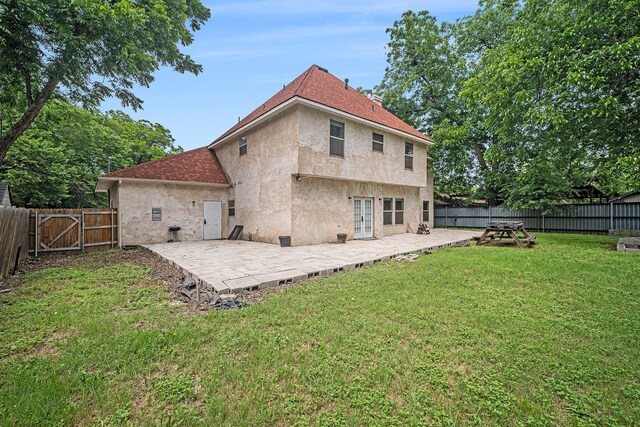 5716 Wall Ave, Haltom City, TX 76117 - back of property with a patio, stucco siding, french doors, and roof with shingles