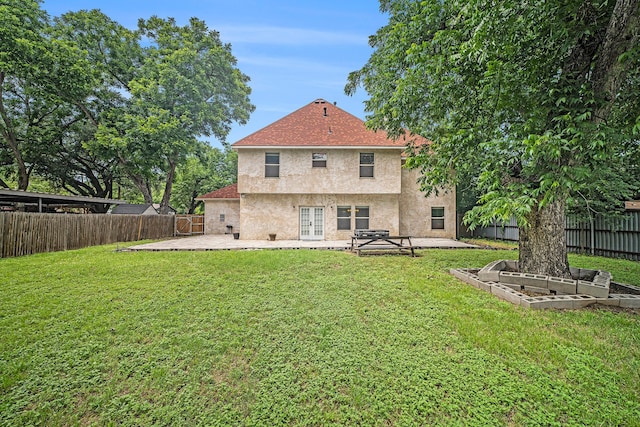 5716 Wall Ave, Haltom City, TX 76117 - rear view of house with french doors, stucco siding, a patio, and a garden