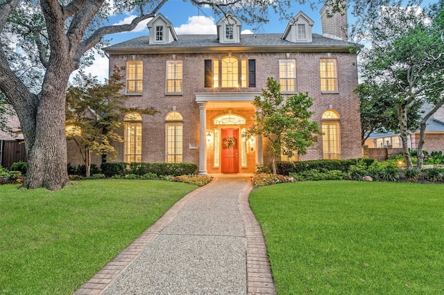 5932 Royal Palm Dr, Plano, TX 75093 - colonial home featuring brick siding, a front lawn, and a chimney