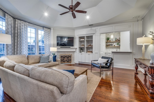 5932 Royal Palm Dr, Plano, TX 75093 - living room with a ceiling fan, a fireplace with flush hearth, dark wood finished floors, built in features, and vaulted ceiling