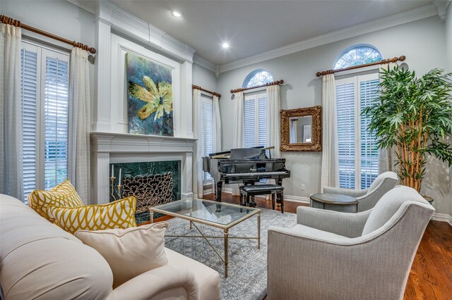 5932 Royal Palm Dr, Plano, TX 75093 - living area with wood finished floors, a fireplace, ornamental molding, baseboards, and recessed lighting