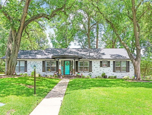 3614 Birdwell Dr, Tyler, TX 75701 - ranch-style home with a front yard, brick siding, and roof with shingles