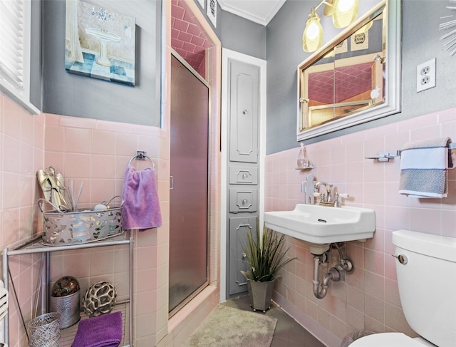 3614 Birdwell Dr, Tyler, TX 75701 - full bath with tile walls, a shower stall, toilet, tile patterned floors, and a sink