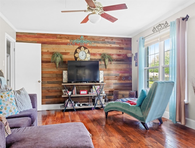 3614 Birdwell Dr, Tyler, TX 75701 - living room with wooden walls, ornamental molding, hardwood / wood-style floors, a ceiling fan, and baseboards
