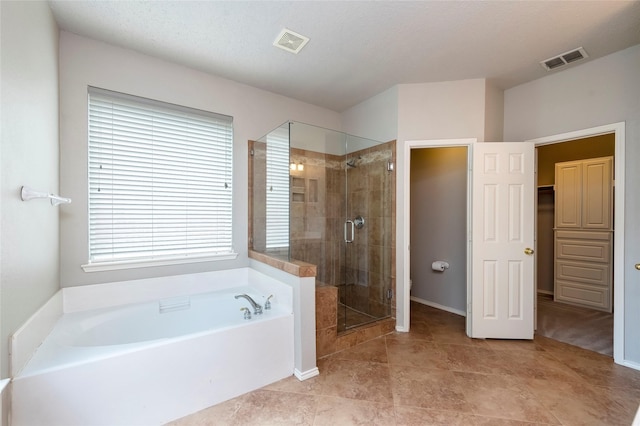 9405 Meyers Cyn, Plano, TX 75025 - bathroom featuring a garden tub, a stall shower, and tile patterned flooring
