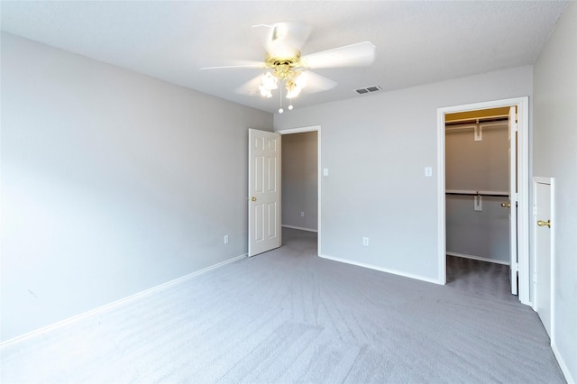 9405 Meyers Cyn, Plano, TX 75025 - unfurnished bedroom with carpet floors, a spacious closet, baseboards, and a ceiling fan