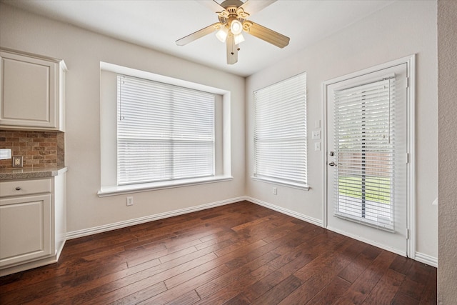 11181 Clearstream Ln, Frisco, TX 75035 - unfurnished dining area with baseboards, ceiling fan, and dark wood-style flooring