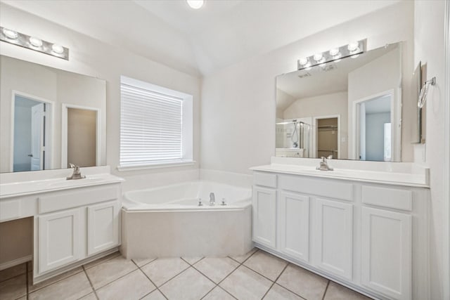 11181 Clearstream Ln, Frisco, TX 75035 - full bathroom with a bath, a shower stall, two vanities, tile patterned floors, and lofted ceiling