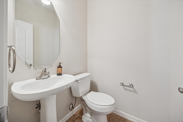 11181 Clearstream Ln, Frisco, TX 75035 - bathroom featuring baseboards, toilet, and tile patterned floors