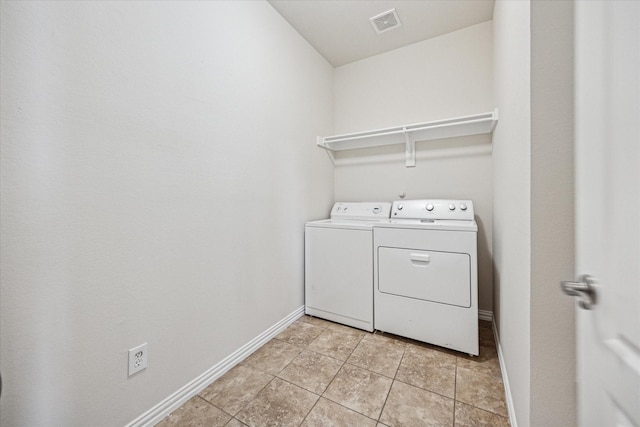 11181 Clearstream Ln, Frisco, TX 75035 - laundry room featuring washer and dryer, baseboards, and light tile patterned flooring