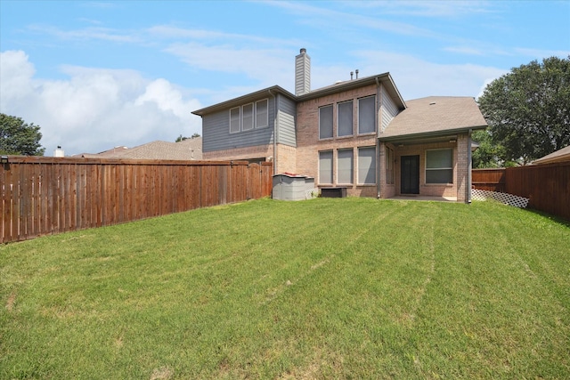 11181 Clearstream Ln, Frisco, TX 75035 - rear view of property featuring brick siding and a chimney