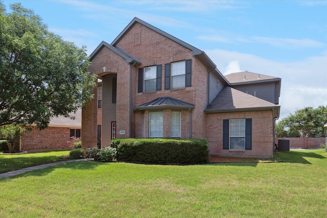 11181 Clearstream Ln, Frisco, TX 75035 - traditional-style home featuring brick siding, a front yard, central AC unit, and a shingled roof