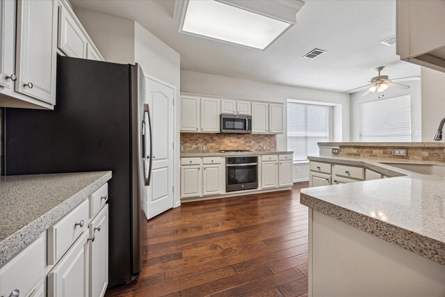 11181 Clearstream Ln, Frisco, TX 75035 - kitchen featuring appliances with stainless steel finishes, a sink, backsplash, dark wood-style floors, and ceiling fan