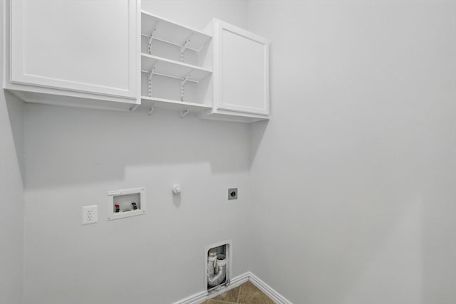 237 Cedar Crest Dr, Justin, TX 76247 - laundry room featuring baseboards, hookup for a washing machine, hookup for an electric dryer, cabinet space, and hookup for a gas dryer