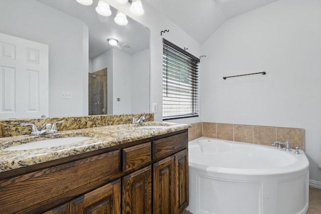 237 Cedar Crest Dr, Justin, TX 76247 - bathroom featuring a stall shower, a garden tub, double vanity, and vaulted ceiling