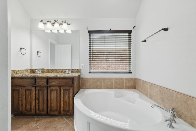 237 Cedar Crest Dr, Justin, TX 76247 - bathroom featuring a bath, double vanity, and tile patterned flooring