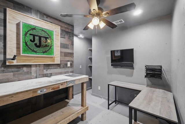 237 Cedar Crest Dr, Justin, TX 76247 - office with ceiling fan, finished concrete flooring, and wooden walls