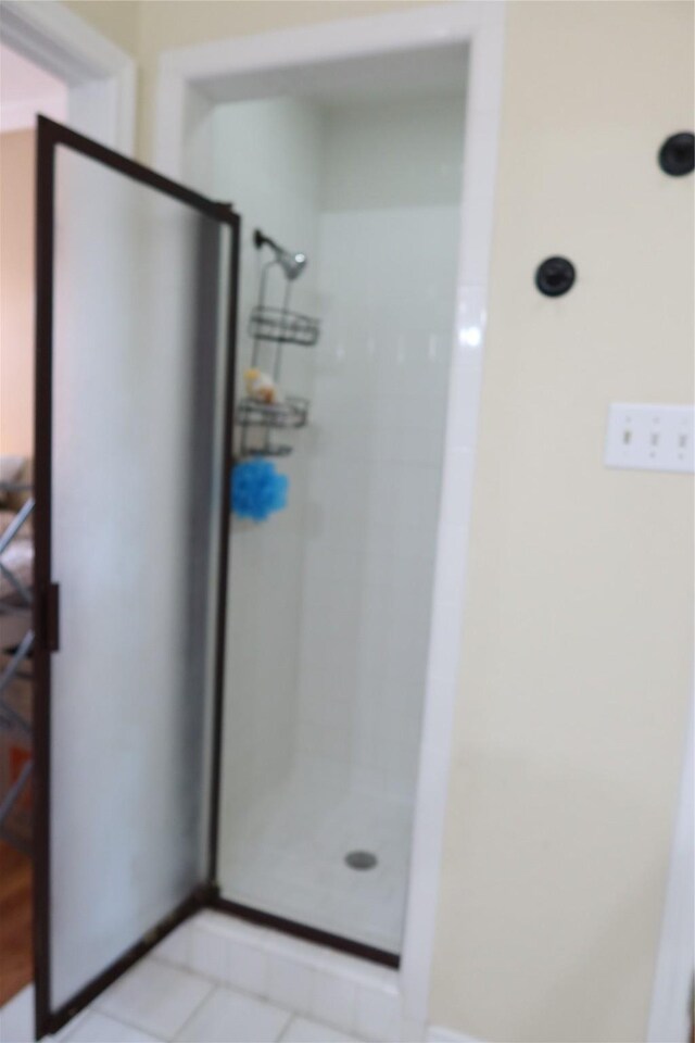 2003 Hearthside Ln, Garland, TX 75044 - bathroom with a shower stall and tile patterned flooring