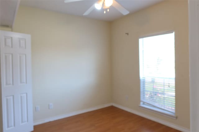 2003 Hearthside Ln, Garland, TX 75044 - unfurnished room with light wood-type flooring, a ceiling fan, and baseboards
