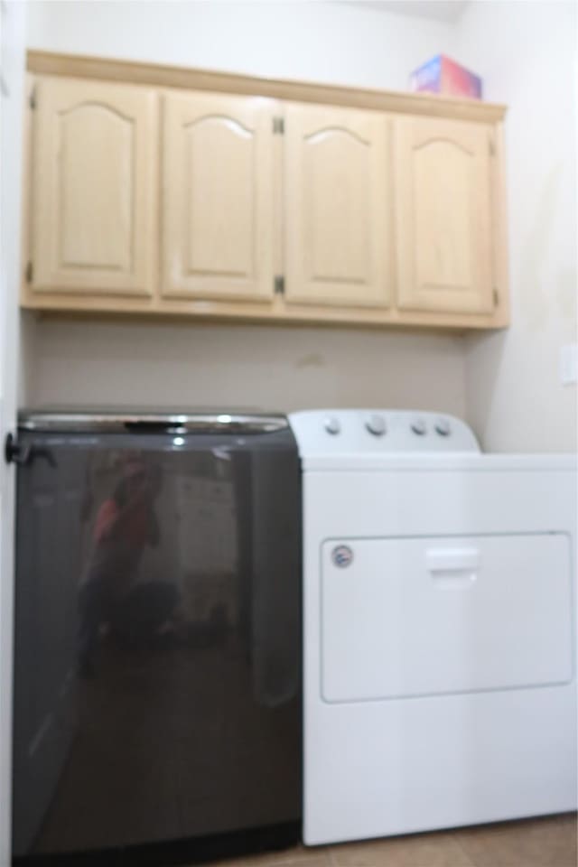 2003 Hearthside Ln, Garland, TX 75044 - laundry room featuring cabinet space and washing machine and clothes dryer