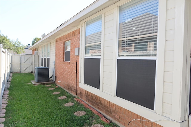 2003 Hearthside Ln, Garland, TX 75044 - view of property exterior with central air condition unit and brick siding
