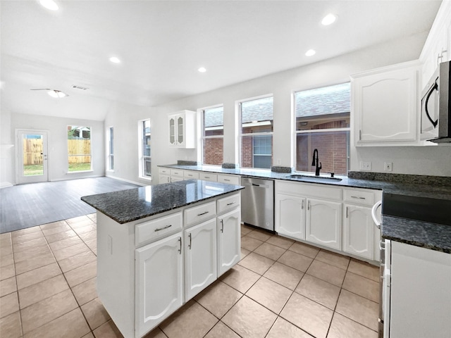 3032 Thicket Bend Ct, Fort Worth, TX 76244 - kitchen featuring stainless steel appliances, a sink, recessed lighting, light tile patterned floors, and white cabinets