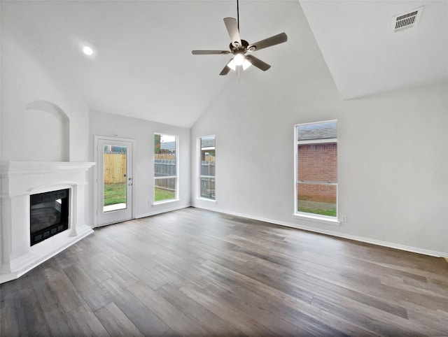 3032 Thicket Bend Ct, Fort Worth, TX 76244 - unfurnished living room featuring wood finished floors, a glass covered fireplace, a ceiling fan, baseboards, and high vaulted ceiling