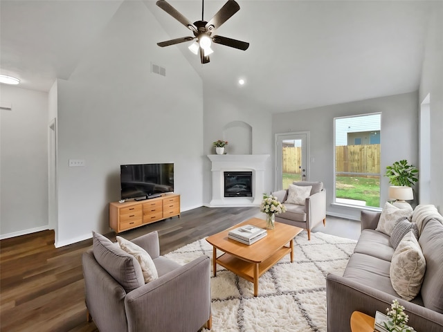 3032 Thicket Bend Ct, Fort Worth, TX 76244 - living area with ceiling fan, a glass covered fireplace, high vaulted ceiling, wood finished floors, and baseboards