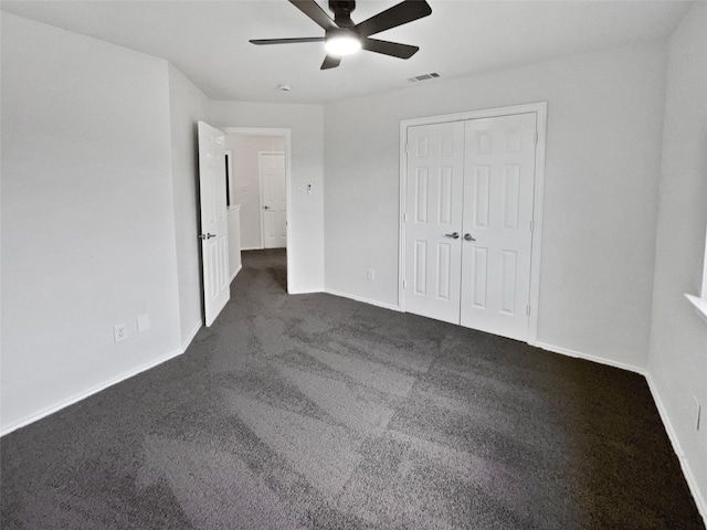 3032 Thicket Bend Ct, Fort Worth, TX 76244 - unfurnished bedroom featuring dark carpet, baseboards, a ceiling fan, and a closet