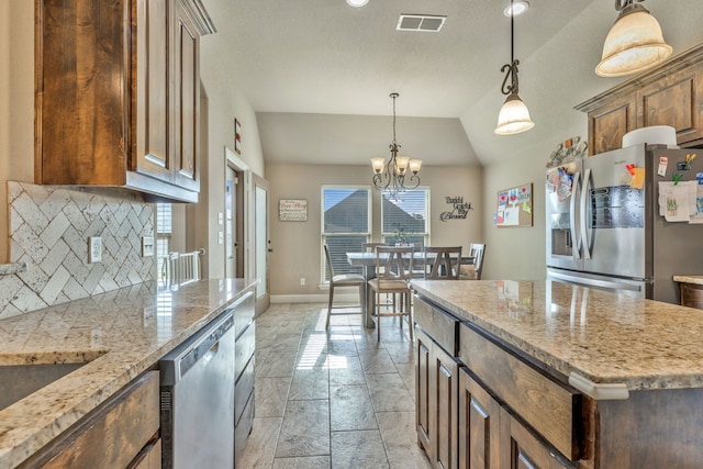 183 Melbourne Dr, Willow Park, TX 76087 - kitchen featuring appliances with stainless steel finishes, baseboards, a chandelier, lofted ceiling, and hanging light fixtures